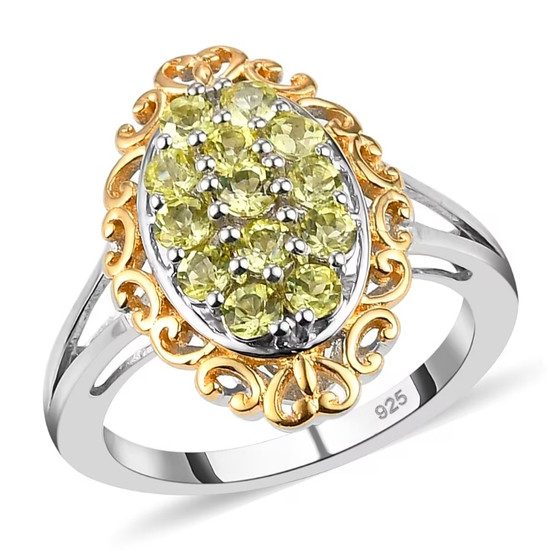 front view of yellow tourmaline cluster ring with oval multi stone setting framed by gold scrollwork over sterling silver