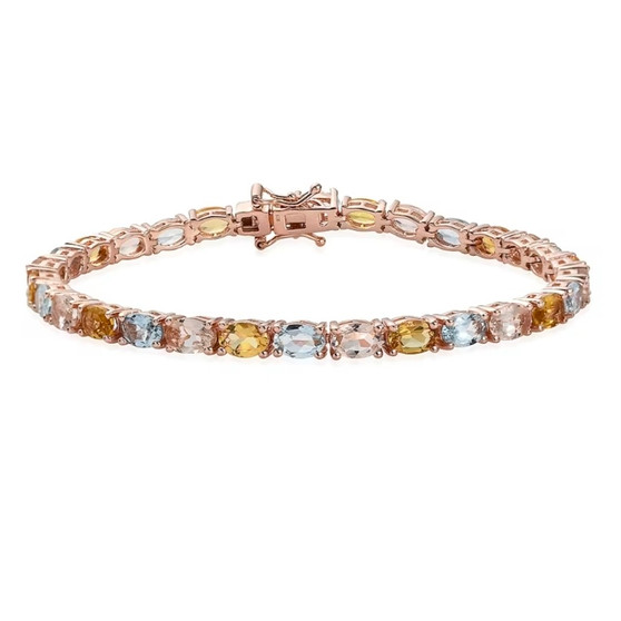front view of aquamarine and morganite heliodor oval tennis bracelet in 18k rose gold over sterling silver