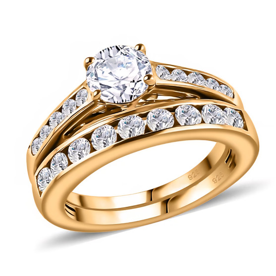 angled view of moissanite bridal ring set in 18k yellow gold over sterling silver