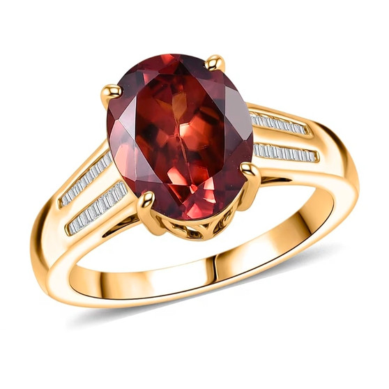 front view of red zircon and diamond solitaire ring in 10k yellow gold