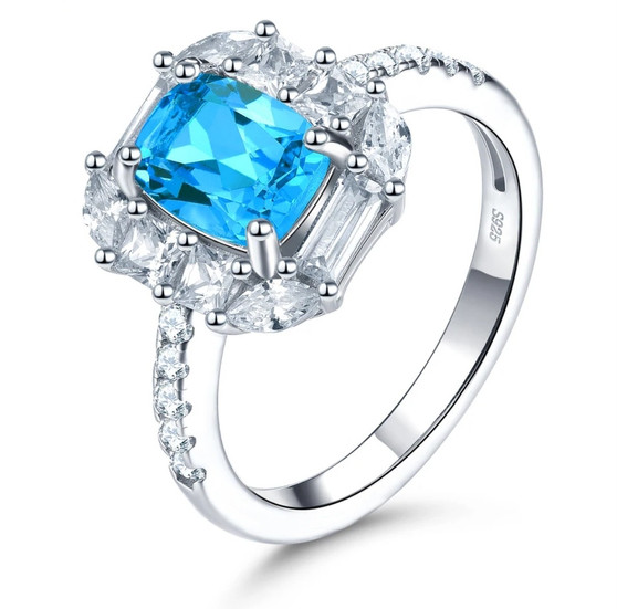 swiss blue topaz and white zircon halo ring in rhodium over sterling silver