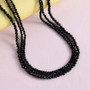black spinel rondelle beaded triple strand 20" necklace in rhodium over sterling silver shown in a lifestyle photo