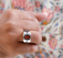 mens citrine black spinel and white zircon ring in rhodium over sterling silver worn on a hand