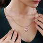 pink opal rhodolite garnet and zircon halo necklace in 18k rose gold over sterling silver worn around the neck