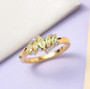 chrysoberyl marquise and white zircon ring in 18k yellow gold over sterling silver shown in a lifestyle photo