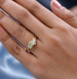 chrysoberyl marquise and white zircon ring in 18k yellow gold over sterling silver worn on a hand