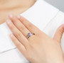 amethyst crown ring in rhodium over sterling silver worn on a hand