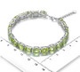 peridot mixed oval and emerald cut tennis bracelet in rhodium over sterling silver shown for size comparison