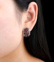 garnet or sky blue topaz cluster omega back earrings in rhodium over sterling silver worn on the ear