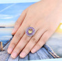 citrine amethyst and white zircon cluster halo ring in rhodium over sterling silver worn on a hand