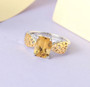 heliodor solitaire ring in 18k yellow gold and rhodium over 925 sterling silver shown in a lifestyle photo