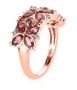 side view of pink tourmaline and white zircon flower cluster band ring in 18k rose gold over sterling silver