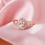 morganite and white zircon halo ring in 18k rose gold over sterling silver shown in a lifestyle photo