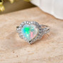 ethiopian opal and lab diamond heart halo ring in 10k white gold shown in a lifestyle photo