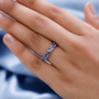 trillion tanzanite band ring in rhodium over sterling silver worn on a hand
