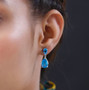 blue quartz triplet drop earrings in rhodium over sterling silver worn on the ear