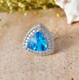 fancy cut trillion swiss blue topaz and moissanite halo ring in rhodium over sterling silver live studio