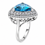 fancy cut trillion swiss blue topaz and moissanite halo ring in rhodium over sterling silver side angle