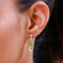 lemon quartz and white zircon dangle earrings in rhodium over sterling silver worn on the ear