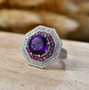 amethyst rhodolite and white zircon deco double halo ring in rhodium over sterling silver shown in a lifestyle photo
