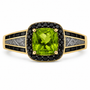 peridot with meteorite inlay and black spinel halo ring in 18k vermeil yellow gold and black rhodium prong tips over sterling silver flat lay
