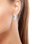 rhodium over sterling silver hoop earrings worn on the ear