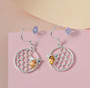 citrine bee honeycomb dangle earrings in rhodium over sterling silver shown in a lifestyle photo