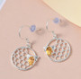 side view of citrine bee honeycomb dangle earrings in rhodium over sterling silver