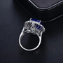 close up of tanzanite and diamond double halo 18k white gold ring convertible necklace