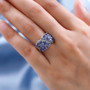tanzanite and white zircon cluster ring in rhodium over sterling silver worn on a hand