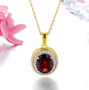 garnet and white zircon halo pendant necklace in 18k yellow gold over sterling silver shown in a lifestyle photo