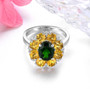 side view of chrome diopside citrine and zircon halo ring in rhodium over sterling silver