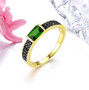 chrome diopside and black spinel band ring in black rhodium and 18k yellow gold over sterling silver shown in a lifestyle photo