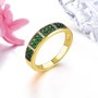 chrome diopside and white zircon band ring in 18k yellow gold over sterling silver shown in a lifestyle photo
