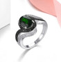 chrome diopside black spinel and white zircon ring in black and white rhodium over sterling silver shown in a lifestyle photo