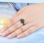 chrome diopside black spinel and white zircon ring in black and white rhodium over sterling silver worn on a hand