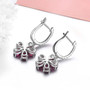 back view of rhodolite garnet and zircon flower cluster drop earrings in rhodium over sterling silver