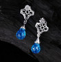 back view of briolette swiss blue topaz and diamond 18k white gold drop earrings