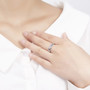 tanzanite band ring in rhodium over sterling silver worn on a hand