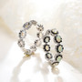 opal and black spinel inside-outside hoop earrings in rhodium over sterling silver shown in a lifestyle photo