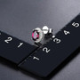 rhodolite garnet and white zircon 7x5mm oval halo earrings in rhodium over sterling silver shown for size comparison