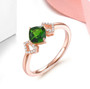 chrome diopside and white zircon gemstone ring in 18k rose gold over sterling silver shown in a lifestyle photo