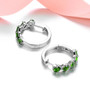 close up of chrome diopside and white zircon hoops in rhodium over sterling silver