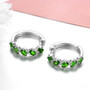 side view of chrome diopside and white zircon hoops in rhodium over sterling silver