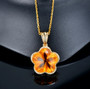 citrine flower cut and diamond pendant necklace in 14k yellow gold shown in a lifestyle photo