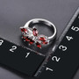 garnet leaf cluster ring in rhodium over sterling silver shown for size comparison