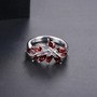 front view of garnet leaf cluster ring in rhodium over sterling silver