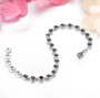 garnet bracelet in rhodium over sterling silver shown in a lifestyle photo