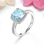sky blue topaz and zircon square cushion halo ring in rhodium over sterling silver shown in a lifestyle photo