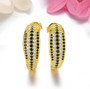 black spinel and white zircon drop earrings in 18k yellow gold over sterling silver shown in a lifestyle photo